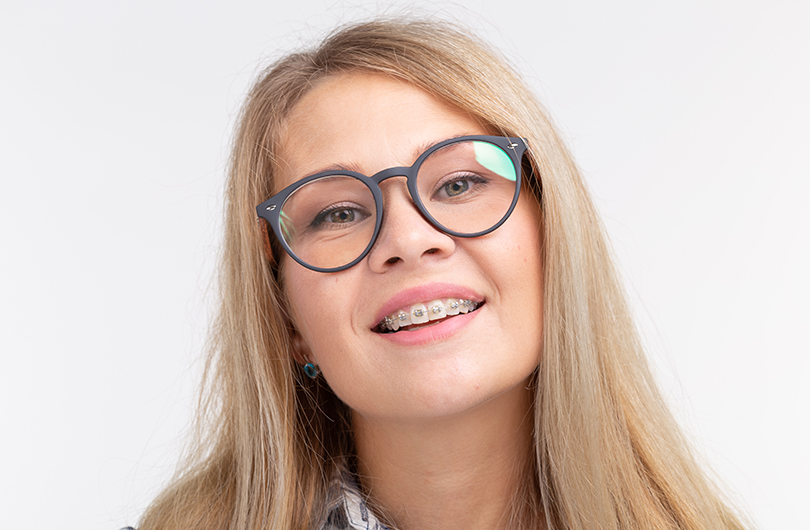 A woman glasses braces portrait