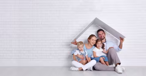 Composite graphic showing a family under house outline graphic
